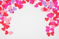 Valentines Day arched border with paper heart confetti over a white background Royalty Free Stock Photo