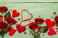 Valentines Day background with assorted hearts, fresh burgundy roses and red festive ribbon Royalty Free Stock Photo