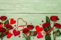 Valentines Day background with assorted hearts, fresh burgundy roses and red festive ribbon Royalty Free Stock Photo