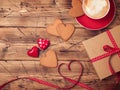 Valentines day background with coffee cup, heart shape cookies and gift box. Royalty Free Stock Photo