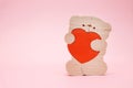 Valentines Day background. Cute teddy Bear toy with red heart on pink background. February 14 greeting card. Royalty Free Stock Photo