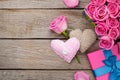 Valentines day background with gift box full of pink roses and h Royalty Free Stock Photo