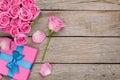 Valentines day background with gift box full of pink roses Royalty Free Stock Photo