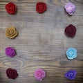 Valentines day background. Group of roses border rectangle form over wooden table. Top view with copy space Royalty Free Stock Photo