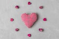 Valentines day background. Handmade textile heart in frame made of dried peony flowers and wooden hearts Royalty Free Stock Photo