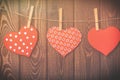 Valentines day background. Handmade toy hearts hanging from a rope on wood Royalty Free Stock Photo