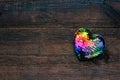 Valentines Day background, mockup with one Lgbt rainbow heart on rustic wooden background. Valentine Day, love, romance, dating