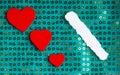 Valentines day background. paper blank hearts on green fabric material Royalty Free Stock Photo