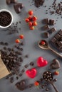 Valentines Day background with red and dark chocolates, hearts a