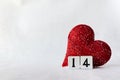 Valentines Day background with red heart and wood calendar with number 14. copy space