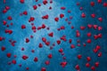 Valentines Day background. Red hearts on dark blue background. Copy space, top view Royalty Free Stock Photo