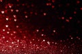 Valentines day background with red hearts glitter bokeh on black, card for Valentine`s day, christmas and wedding celebration, Lov