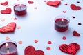 Valentines day background: red love hearts, romantic gift box, candle on white table. February romance present card. Royalty Free Stock Photo