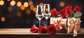 Valentines day background with red roses, gift box and glasses of wine on wooden table. Royalty Free Stock Photo