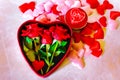 Valentines Day background. Red Roses with hearts and candle on pink background Royalty Free Stock Photo