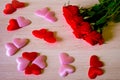Valentines Day background. Red Roses with hearts on wooden background Royalty Free Stock Photo