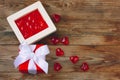 Valentines day background, sweet heart and red gift box on wooden table Royalty Free Stock Photo