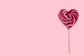 Valentines day background, sweet love, heart shaped lollipop on pink backdrop. romance and celebration concept