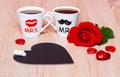 Background with two coffee cups, hearts, chalkboard and rose flower Royalty Free Stock Photo