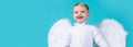 Valentines day banner with angel child. Little angel boy making funny face. Valentines angels. Cute cupid boy. Royalty Free Stock Photo