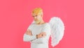 Valentines Day. Bearded man in angel wings with folded hands. Cupid in valentine day. Love concept.