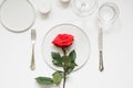 Valentines day or birthday romantic dinner. Elegance table setting with red rose Royalty Free Stock Photo