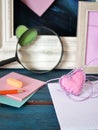 Valentines day, on a blue wooden table, an empty notebook, frames, pencils, felt hearts, bookmarks, preparation concept