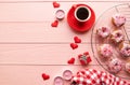 Valentines day brackfast with coffe and donuts isolated on pink wooden background
