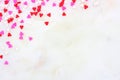 Valentines Day candy heart sprinkles corner border over a white textured background Royalty Free Stock Photo