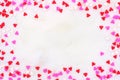 Valentines Day candy heart sprinkles frame over a white textured background Royalty Free Stock Photo