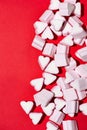 Valentines Day candy hearts marshmallows over red background Royalty Free Stock Photo