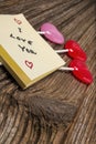 Valentines day candy,sticky-note pad on barnwood