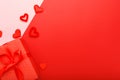 Valentines day card with copy space frame. Red background with hearts present gift ribbon. Concept of Valentine Day Love Romance Royalty Free Stock Photo