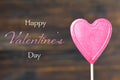 Valentines Day card. Heart candy lollipop on wooden background Royalty Free Stock Photo