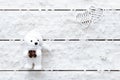 Valentines day card, snowflakes, hearts and toy bear on light wooden table, white flakes of snow on xmas desk, merry Christmas hol Royalty Free Stock Photo