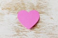 Valentines day card with sticky note in the shape of a heart on a wooden background Royalty Free Stock Photo