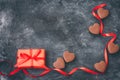 valentines day, chocolate heart, red ribbon, gift box on black Royalty Free Stock Photo