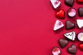 Valentines Day chocolate side border on a red paper background Royalty Free Stock Photo