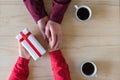 Valentines day.  Close-up of woman and man celebrating in restaurant. Boyfriend giving small box gift to girlfriend. love, romance Royalty Free Stock Photo