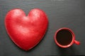 Valentines day composition with coffee cup and heart of red velvet cake on slate plate. Top view. Copy space. Royalty Free Stock Photo