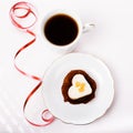 Valentines day composition with coffee cup and heart shape cake on white table. Top view. Copy space. Royalty Free Stock Photo