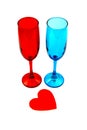 Valentines day composition. Two multycolored blue and red champagne glasses and red valentines heart