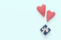 Valentines day composition. Two soft red hearts and gift box on pastel blue background. Flat lay, top view, copy space Royalty Free Stock Photo