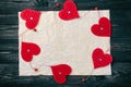 Valentines Day concept. Dark wooden background for design to Valentine`s Day project. Decorative red hearts frame on old crumpled Royalty Free Stock Photo