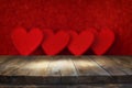 Valentines day concept. Empty table in front of glitter red hearts