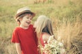 Valentines day concept. First love. The concept of child friendship and kindness. Kid having fun in spring field Royalty Free Stock Photo