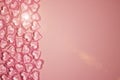Valentines Day Concept. Glass transparent hearts on pink background, glass heart glows, glass painting. Many red glass hearts. Royalty Free Stock Photo