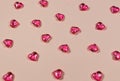 Valentines Day Concept. Glass transparent hearts on pink background, glass heart glows, glass painting. Many red glass Royalty Free Stock Photo