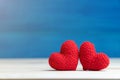 Valentines day concept. hand make two yarn red heart on wooden table and blue backgroundValentines day concept. hand make two yarn Royalty Free Stock Photo