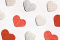 Valentines day concept, knit hearts valentine as creative pattern, handmade colored crochet heart on white wooden table